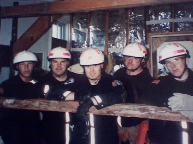 Sgt. Dewey Snavely, center, and other Soldiers from the Military District of Washington Engineer Company, now called the 911th Technical Rescue Engineer Company. The Soldiers specialize in urban search and rescue operations in the National Capital Region and were some of the first to respond to the terrorist attack at the Pentagon on Sept. 11, 2001.