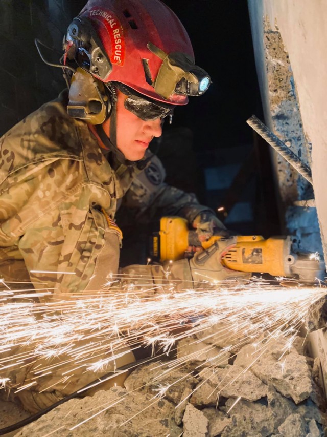 A Soldier from the 911th Technical Rescue Engineer Company welds during a platoon validation exercise at the military operations in urban terrain facility on Marine Corps Base Quantico, Va., in April 2021. 